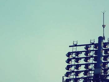 Low angle view of communications tower against clear sky