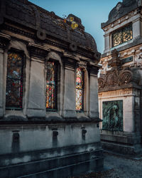 Low angle view of statue against historic building