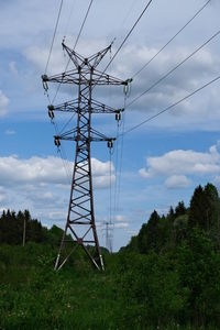 Low angle view of electricity pylon against sky