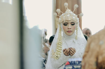 Close-up of bride during wedding ceremony