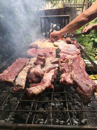 High angle view of meat on barbecue grill