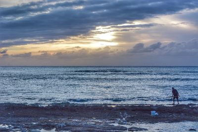 Scenic view of sea at sunset