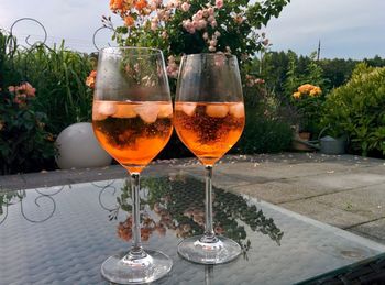 Close-up of aperol spritz in wineglass on table at restaurant