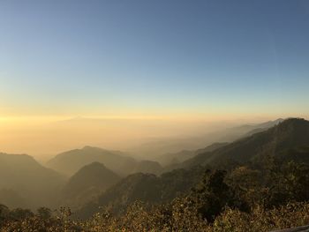 Scenic view of mountains against sky during sunset