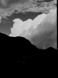 Low angle view of silhouette mountains against sky