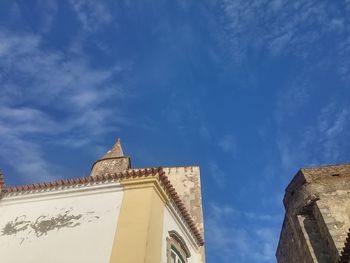 Low angle view of building against blue sky