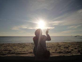 Full length of man at beach against sky