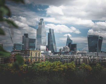 Modern buildings in city against sky