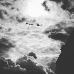 Low angle view of building against cloudy sky