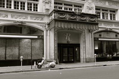 Street by building in city