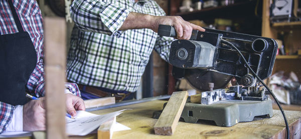 Man working on barbecue grill