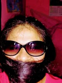 Close-up portrait of man wearing sunglasses