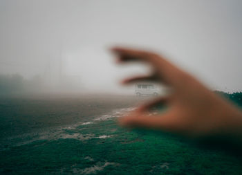 Blurred motion of man on field against sky