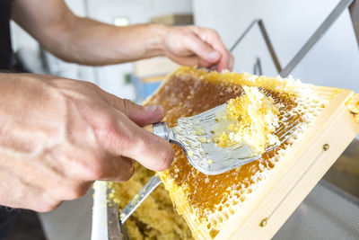 Close-up of man preparing food