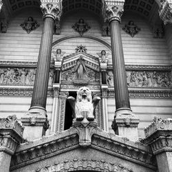 Low angle view of statue against temple