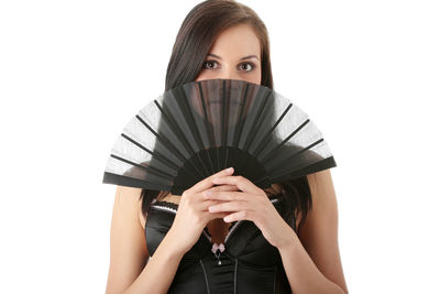 Portrait of woman standing against white background