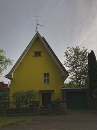 Exterior of yellow building against sky