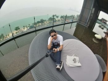 High angle view of man using mobile phone in city