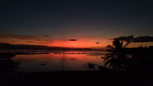 Scenic view of sea against romantic sky at sunset