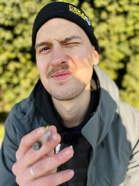 Portrait of young man wearing hat