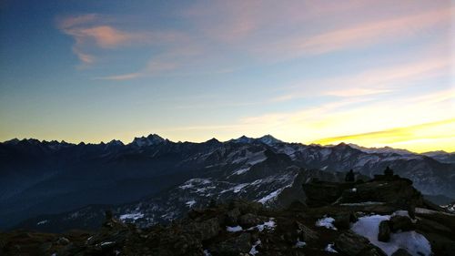 Scenic view of mountains against sky during sunset
