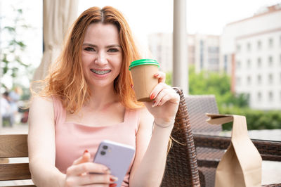 Young woman using mobile phone