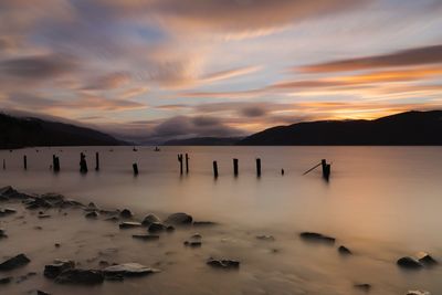 Scenic view of lake against sky during sunset