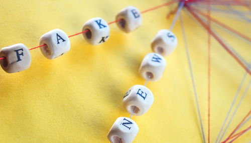 Close-up high angle view of yellow and objects on table