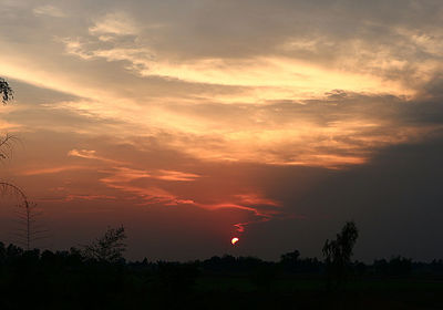 Scenic view of dramatic sky during sunset