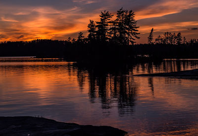 Scenic view of lake at sunset