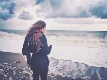 Scenic view of sea against cloudy sky