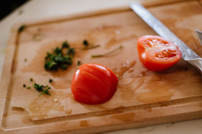 High angle view of chopped tomatoes on cutting board