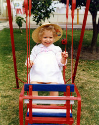 Portrait of cute girl sitting outdoors