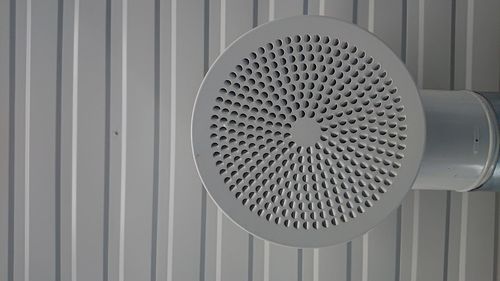 Close-up of electric fan on wall