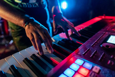 Playing the keyboard on stage at night