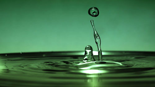 Close-up of drop splashing in water