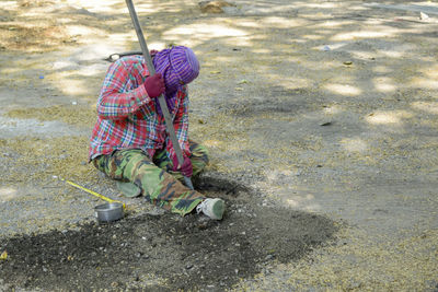 High angle view of men working on footpath