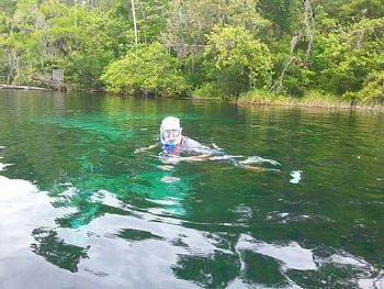 Man swimming in lake