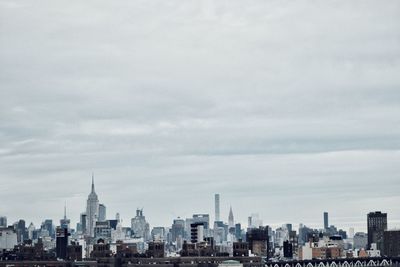 Modern buildings in city against sky