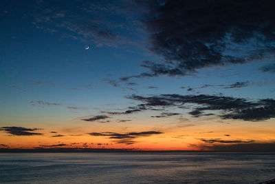 Scenic view of sea against sky at sunset