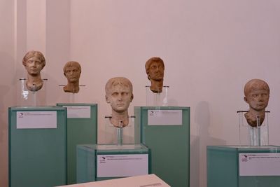 View of books on table against wall in museum