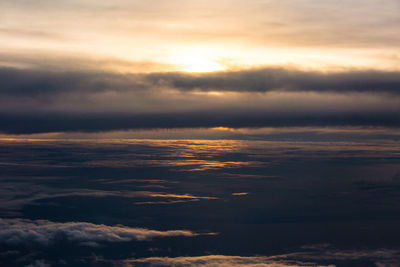 Low angle view of dramatic sky during sunset