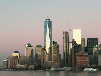 Skyscrapers in city against sky