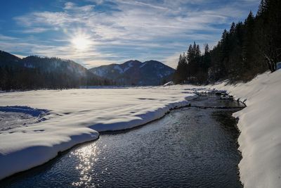 Scenic view of snow covered mountains against sky