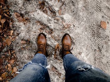 Low section of man standing on ground