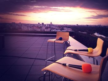 Empty chairs at sunset