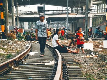 Full length of woman standing on bench
