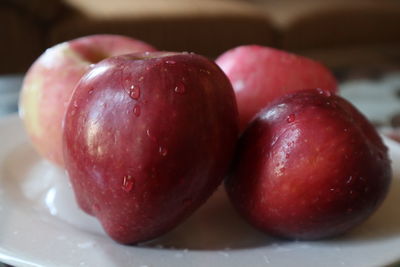 Close-up of wet apple on table