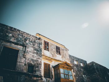 Low angle view of old building against clear sky