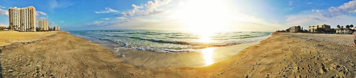 Panoramic view of sea against sky during sunset